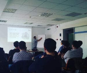 Lucian Lesu, Computaris QA Engineer, delivering a presentation at the Bucharest Testing Camp hosted by Computaris